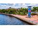 Riverwalk with palm trees, and buildings along the waterfront at 12939 Seasong Ter, Bradenton, FL 34211