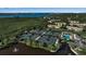 Aerial view of community tennis courts, pool, and residential buildings at 1460 Landings Cir # 51, Sarasota, FL 34231
