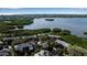 Aerial view of waterfront community with lush vegetation and access to the waterway at 1460 Landings Cir # 51, Sarasota, FL 34231
