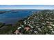 Aerial view of waterfront community with lush landscaping and homes at 1460 Landings Cir # 51, Sarasota, FL 34231