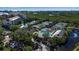 Aerial view of community amenities including tennis courts and pool at 1460 Landings Cir # 51, Sarasota, FL 34231