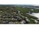 Bird's-eye view of waterfront homes and lush mangroves at 1460 Landings Cir # 51, Sarasota, FL 34231