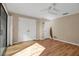Bright bedroom featuring hardwood floors and double doors at 1460 Landings Cir # 51, Sarasota, FL 34231