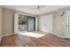 Bedroom with hardwood floors and sliding glass doors to balcony at 1460 Landings Cir # 51, Sarasota, FL 34231