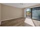 Bedroom with hardwood floors and access to balcony at 1460 Landings Cir # 51, Sarasota, FL 34231