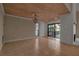 Bright dining area with wood-paneled ceiling, chandelier and sliding glass doors to deck at 1460 Landings Cir # 51, Sarasota, FL 34231