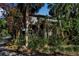 House exterior showcasing a lush, tropical landscape at 1460 Landings Cir # 51, Sarasota, FL 34231