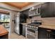 Modern kitchen with stainless steel appliances and dark cabinets at 1460 Landings Cir # 51, Sarasota, FL 34231