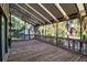 Large screened porch with wood decking, offering a relaxing outdoor space at 1460 Landings Cir # 51, Sarasota, FL 34231