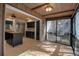 Sunroom with access to kitchen and views of the outdoors at 1460 Landings Cir # 51, Sarasota, FL 34231