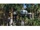 Two-story townhouse with screened porch and tropical landscaping at 1460 Landings Cir # 51, Sarasota, FL 34231