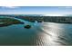 Aerial view of a waterway with boats and waterfront properties on a sunny day at 1460 Landings Cir # 51, Sarasota, FL 34231