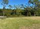 Spacious lot with a large grassy area and natural landscape at 160 Lazy Shore Dr, Nokomis, FL 34275