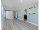 Bright bonus room with light gray vinyl flooring and barn door at 174 Venice East Blvd, Venice, FL 34293