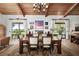 Bright dining room with wooden table and chairs, water views at 1819 Chadwick Rd, Englewood, FL 34223