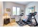 Home gym with treadmill, exercise bike, and weights at 1819 Chadwick Rd, Englewood, FL 34223