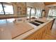 Kitchen island with double sinks and butcher block cutting boards at 1819 Chadwick Rd, Englewood, FL 34223