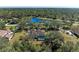 Stunning aerial view of the house and surrounding landscape at 21709 Deer Pointe Xing, Bradenton, FL 34202