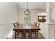 Dining room with wood table and chairs, and natural light at 21709 Deer Pointe Xing, Bradenton, FL 34202