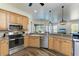 Open concept kitchen with stainless steel appliances and island at 21709 Deer Pointe Xing, Bradenton, FL 34202