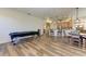 Open concept kitchen and dining area with island, stainless steel appliances, and hardwood floors at 21709 Deer Pointe Xing, Bradenton, FL 34202