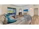 Spacious living room with L-shaped sectional sofa and wood floors at 21709 Deer Pointe Xing, Bradenton, FL 34202