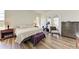 Spacious main bedroom with large windows, wood floors, and en-suite bathroom at 21709 Deer Pointe Xing, Bradenton, FL 34202