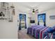 Nautical-themed bedroom with a comfy bed and plenty of natural light at 2419 7Th E Ct, Ellenton, FL 34222