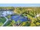 Aerial view of pickleball courts and community at 249 Palmaria Ct, Nokomis, FL 34275