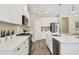 Modern kitchen with stainless steel appliances, island, and ample counter space at 249 Palmaria Ct, Nokomis, FL 34275