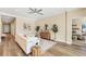 Elegant living room with hardwood floors and neutral paint color with hallway access at 249 Palmaria Ct, Nokomis, FL 34275