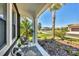 Inviting front porch with seating, a glimpse of the front yard, and exterior view at 249 Palmaria Ct, Nokomis, FL 34275