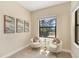 Bright sitting area featuring neutral colors, art decorations and natural light at 249 Palmaria Ct, Nokomis, FL 34275