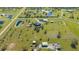 Aerial view showing property with home, barns, acreage and equestrian features perfect for a ranch or farm at 25205 67Th E Ave, Myakka City, FL 34251