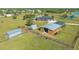 Aerial view of house, barn, shed, and large property at 25205 67Th E Ave, Myakka City, FL 34251