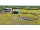 Aerial view of horse property with paddocks, barn, and pasture at 25205 67Th E Ave, Myakka City, FL 34251