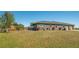 Expansive backyard featuring an outdoor patio and plenty of space for recreation and relaxation at 25205 67Th E Ave, Myakka City, FL 34251
