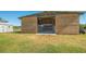 A wooden barn structure on a grassy field with a small shed to the left at 25205 67Th E Ave, Myakka City, FL 34251
