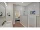 Clean bathroom with white finishes, glass shower, and a connected bedroom view at 25205 67Th E Ave, Myakka City, FL 34251