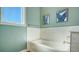 Bright bathroom with a soaking tub, subway tile surround, and neutral paint at 25205 67Th E Ave, Myakka City, FL 34251