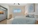 Comfortable bedroom featuring a large bed with plush linens and a serene window view at 25205 67Th E Ave, Myakka City, FL 34251