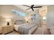 Bright bedroom features a ceiling fan, large window and access to the bathroom at 25205 67Th E Ave, Myakka City, FL 34251
