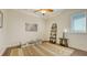 Bright bedroom with unique cloud painted ceiling, playful zebra art, and ample space at 25205 67Th E Ave, Myakka City, FL 34251