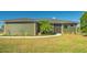 Charming single-story home with a well-manicured lawn and mature landscaping, offering great curb appeal at 25205 67Th E Ave, Myakka City, FL 34251