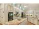 Spacious kitchen with granite countertops, stainless steel appliances, and a central island at 25205 67Th E Ave, Myakka City, FL 34251