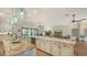 Spacious open kitchen with a large granite island, stainless appliances, and seating area at 25205 67Th E Ave, Myakka City, FL 34251
