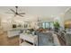Open-concept living space features a modern fireplace, recessed lighting, and sliding doors to the backyard at 25205 67Th E Ave, Myakka City, FL 34251