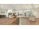 Open floor plan features living room with fireplace, kitchen with island, hardwood floors at 25205 67Th E Ave, Myakka City, FL 34251