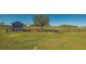 View of pasture with wooden fence and shed at 25205 67Th E Ave, Myakka City, FL 34251