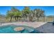 Inviting pool area featuring swim up seating, lush landscaping, and outdoor dining, perfect for entertaining at 25205 67Th E Ave, Myakka City, FL 34251